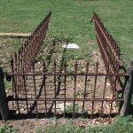 front view of wrought iron fence and wooden post st mary cemetery 2013